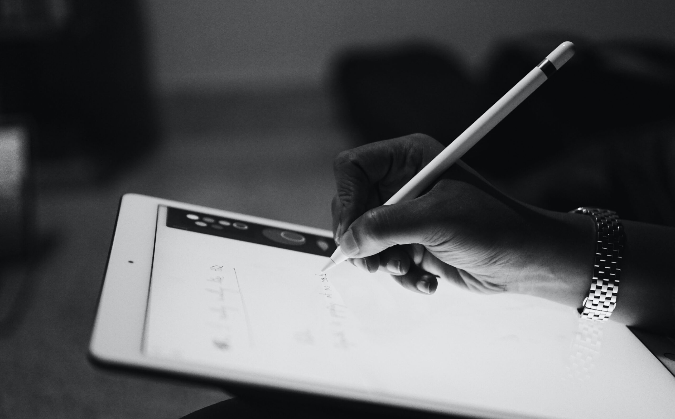 Digital artist drawing a scientific illustration on a pen display using a stylus.